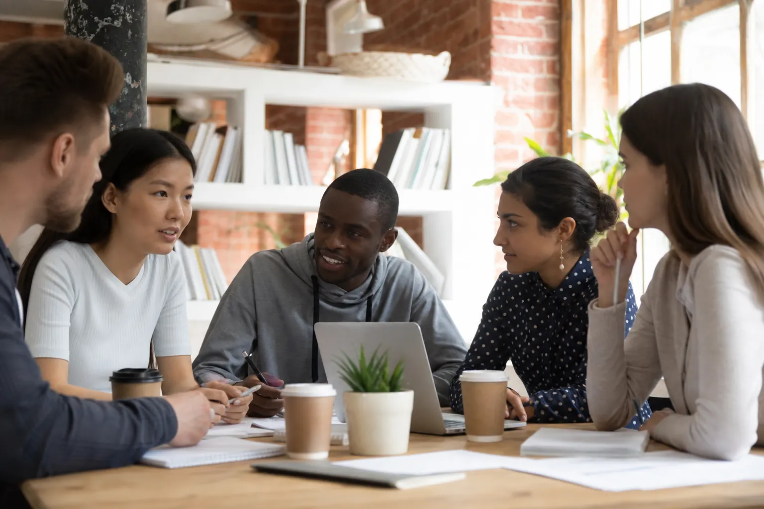 A diverse team collaborating around a table